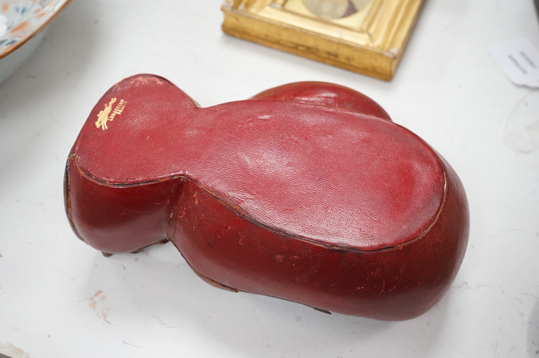 A Longchamp leather boxing glove trinket dish, c.1950s, 23cm wide